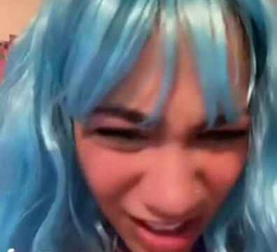 Cyan colored hair girl making NSFW TikTok with her pierced tits and fish net suit